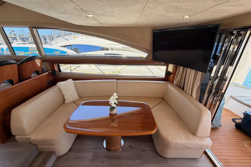 Slide: The Image of Luxurious interior of 2007 Viking Princess 54 Flybridge yacht with elegant seating and table. - 28