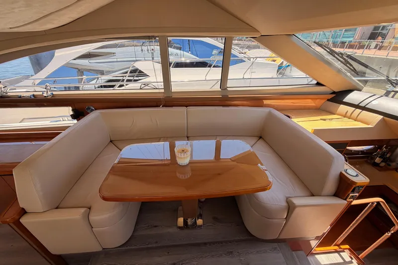 Slide: The Image of Luxurious interior of 2007 Viking Princess 54 Flybridge yacht with elegant seating and table. - 31