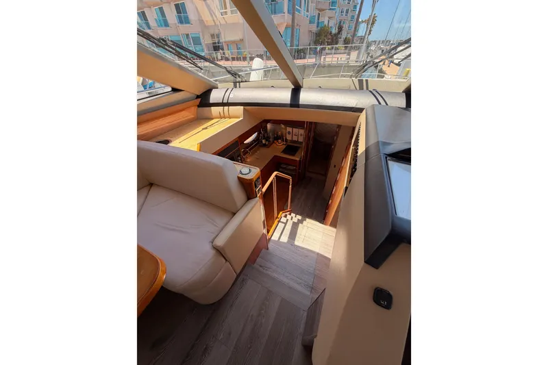 Slide: The Image of Interior view of 2007 Viking Princess 54 Flybridge yacht, featuring elegant seating and wooden flooring. - 41