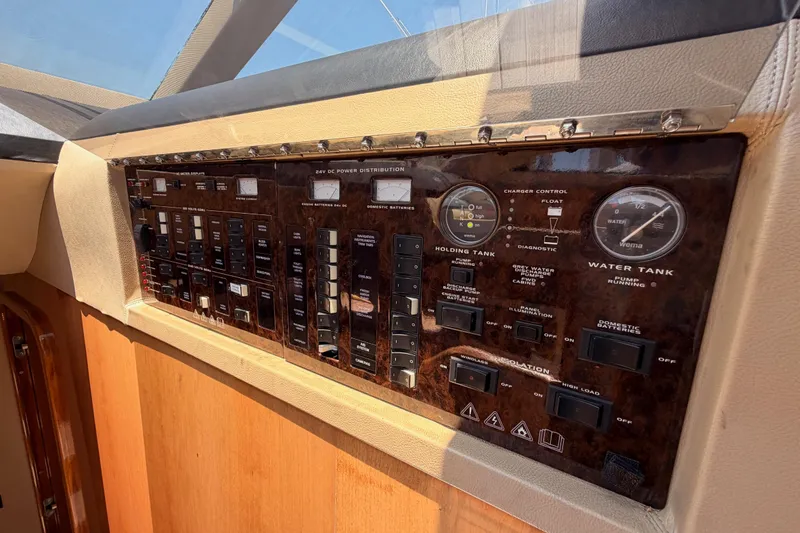 Slide: The Image of Control panel of a 2007 Viking Princess 54 Flybridge yacht, featuring gauges and switches. - 42