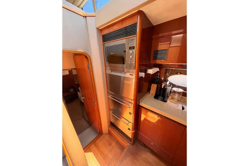 Slide: The Image of Luxurious kitchen interior of 2007 Viking Princess 54 Flybridge yacht with modern appliances. - 45