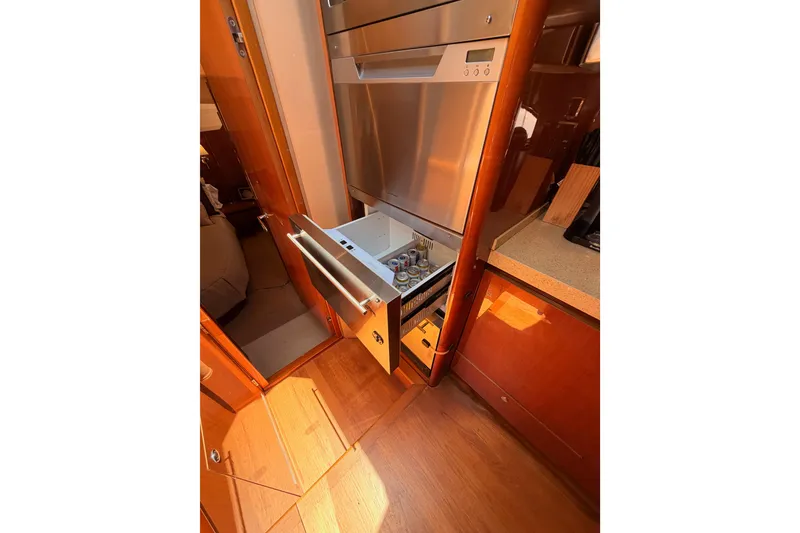 Slide: The Image of 2007 Viking Princess 54 Flybridge yacht kitchen with open drawer refrigerator. - 46