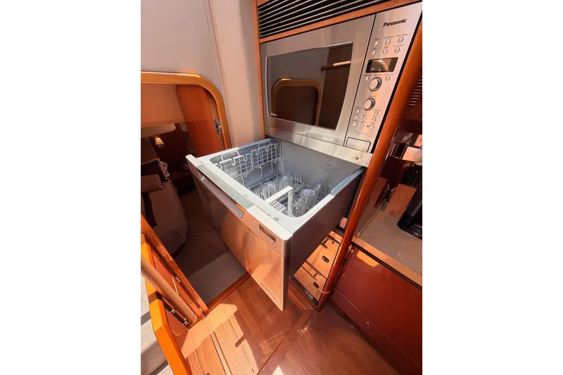 Slide: The Image of Dishwasher and microwave in 2007 Viking Princess 54 Flybridge yacht kitchen. - 47