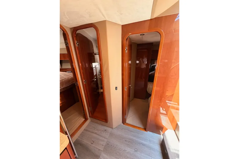 Slide: The Image of Interior of 2007 Viking Princess 54 Flybridge yacht with wooden doors and cozy cabin. - 50