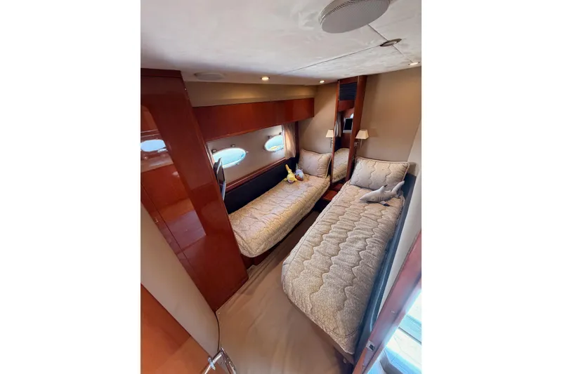 Slide: The Image of Luxurious twin cabin interior of 2007 Viking Princess 54 Flybridge yacht. - 51