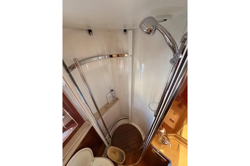 Slide: The Image of Compact shower area in 2007 Viking Princess 54 Flybridge yacht bathroom. - 55