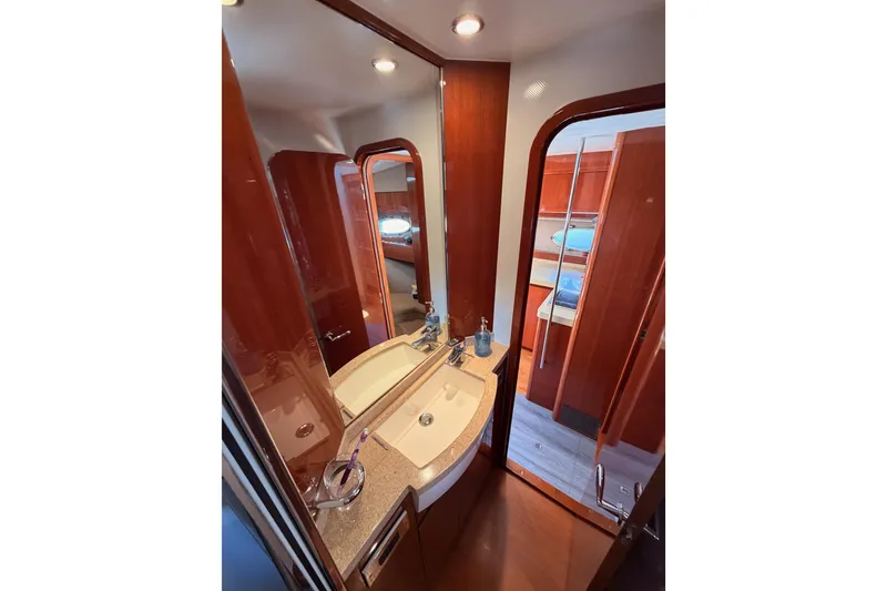 Slide: The Image of Luxurious bathroom interior of 2007 Viking Princess 54 Flybridge yacht with elegant wood finish. - 57