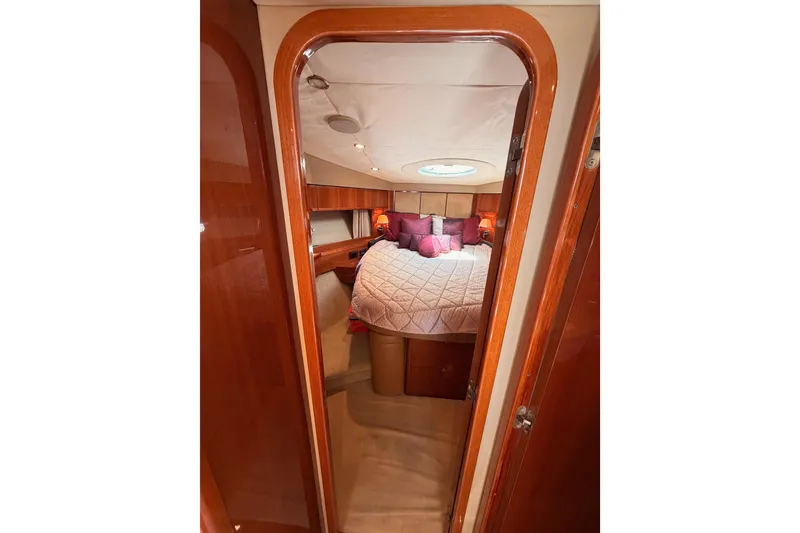 Slide: The Image of Luxurious cabin interior of 2007 Viking Princess 54 Flybridge yacht with elegant bedding. - 58