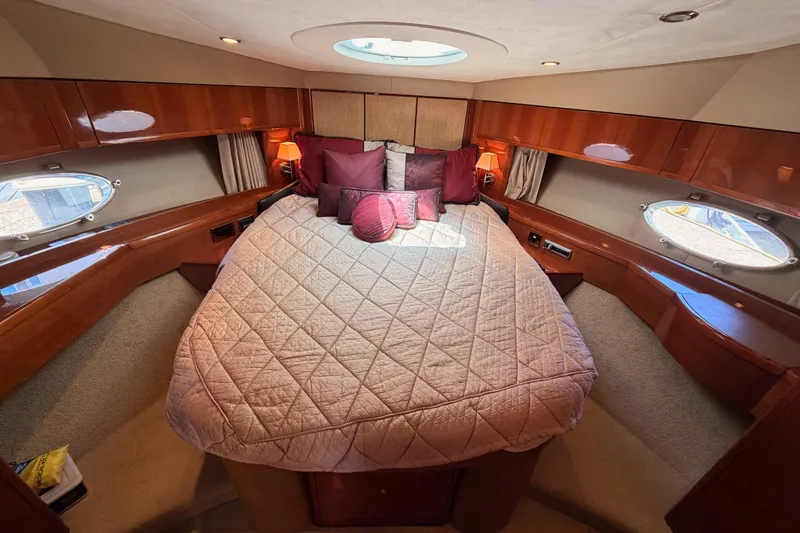 Slide: The Image of Luxurious cabin interior of 2007 Viking Princess 54 Flybridge yacht with elegant bedding. - 59