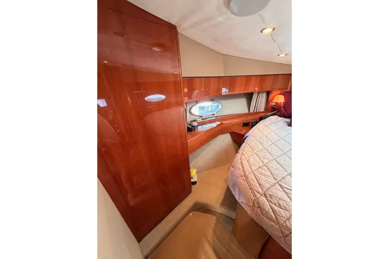 Slide: The Image of Luxurious cabin interior of 2007 Viking Princess 54 Flybridge yacht with wood finish. - 60