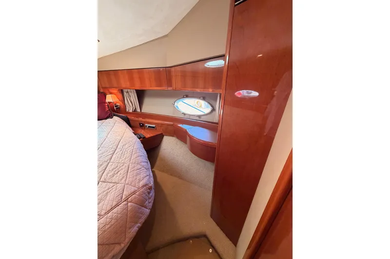 Slide: The Image of Luxurious cabin interior of 2007 Viking Princess 54 Flybridge yacht with elegant wood finish. - 61