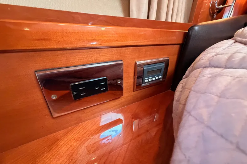 Slide: The Image of Interior of 2007 Viking Princess 54 Flybridge with wood paneling and control panel. - 63