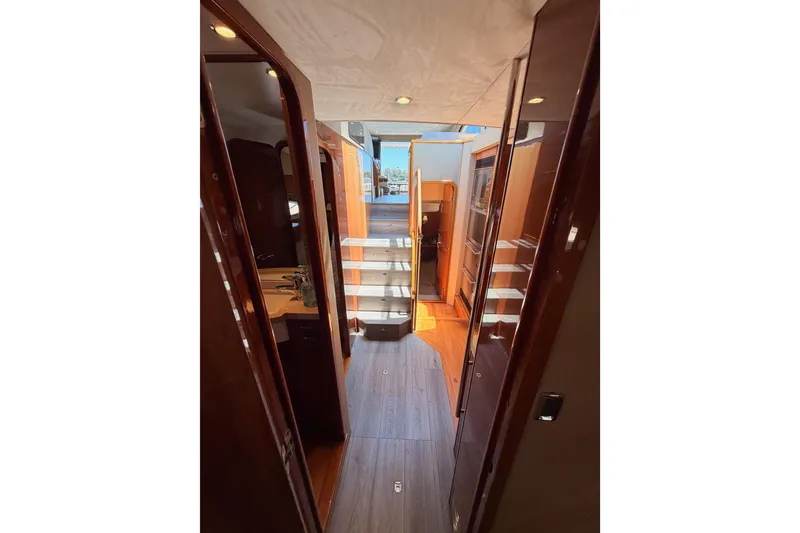 Slide: The Image of Interior view of 2007 Viking Princess 54 Flybridge yacht, featuring elegant wood finishes and modern design. - 65