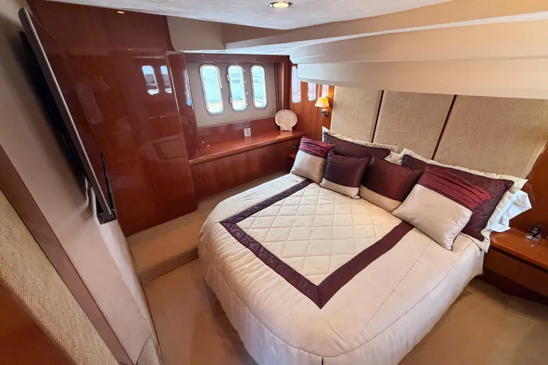 Slide: The Image of Luxurious bedroom interior of 2007 Viking Princess 54 Flybridge yacht with elegant bedding. - 68