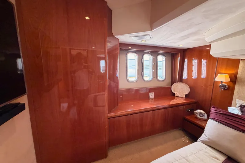 Slide: The Image of Luxurious interior of 2007 Viking Princess 54 Flybridge yacht with polished wood finish. - 69