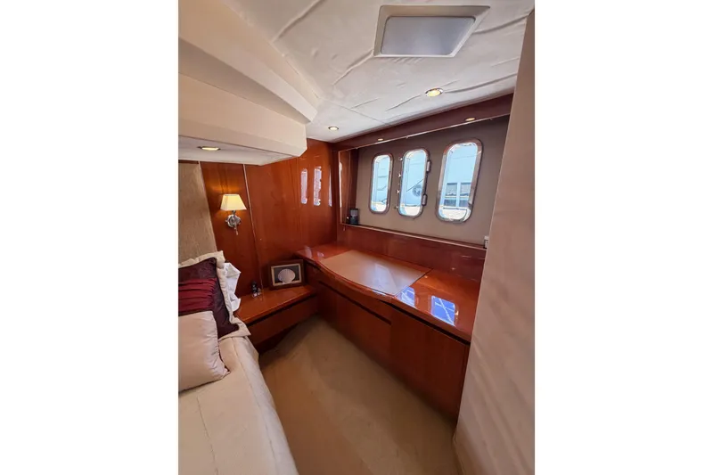 Slide: The Image of Luxurious cabin interior of 2007 Viking Princess 54 Flybridge yacht with elegant wood finish. - 72