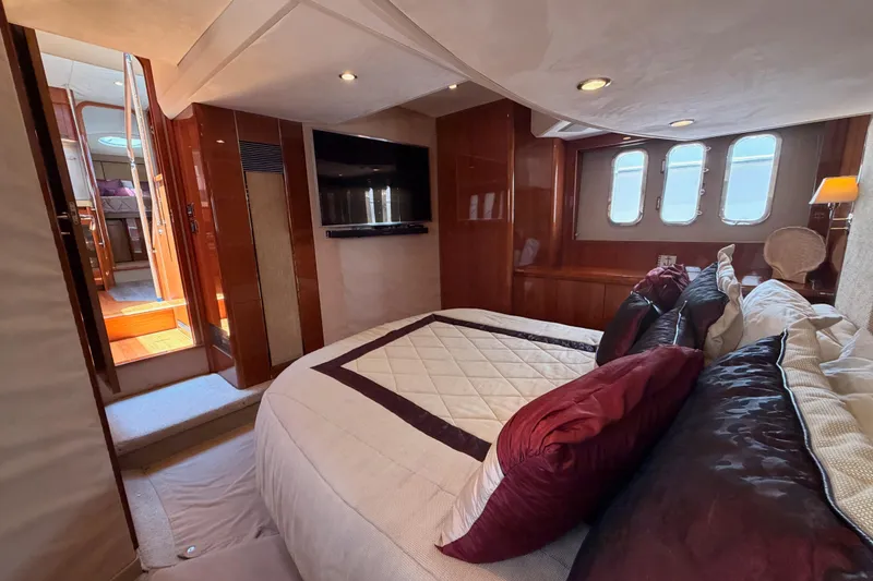 Slide: The Image of Luxurious cabin interior of 2007 Viking Princess 54 Flybridge yacht with elegant bedding and decor. - 73
