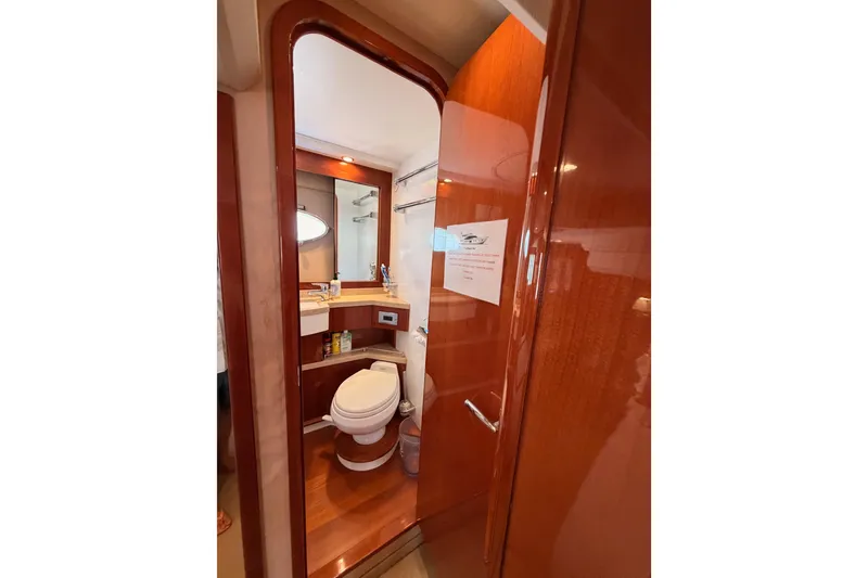 Slide: The Image of Luxurious bathroom on 2007 Viking Princess 54 Flybridge yacht with wood accents and modern fixtures. - 74