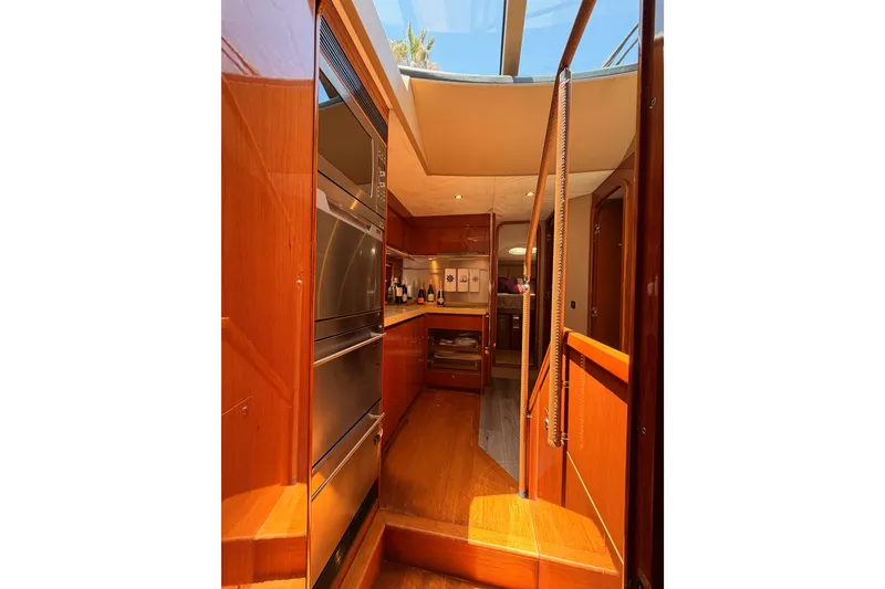 Slide: The Image of Luxurious interior of 2007 Viking Princess 54 Flybridge yacht with modern kitchen amenities. - 77