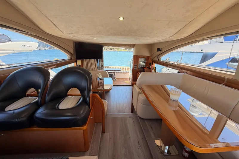 Slide: The Image of Luxurious interior of 2007 Viking Princess 54 Flybridge yacht with elegant seating and scenic views. - 79