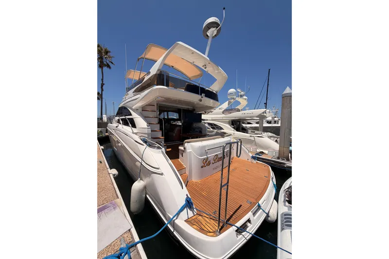 Slide: The Image of Luxury 2007 Viking Princess 54 Flybridge yacht docked at marina. - 8