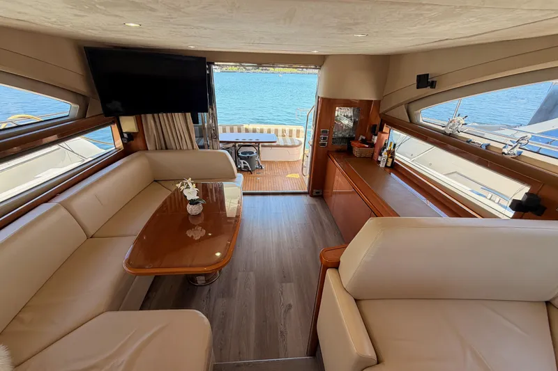 Slide: The Image of Luxurious interior of 2007 Viking Princess 54 Flybridge yacht with elegant seating and ocean view. - 80