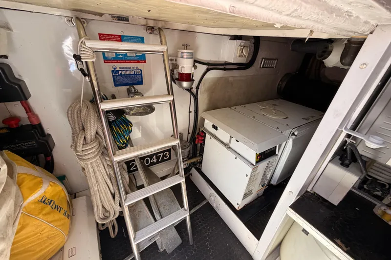Slide: The Image of Engine room of 2007 Viking Princess 54 Flybridge with ladder and equipment. - 86