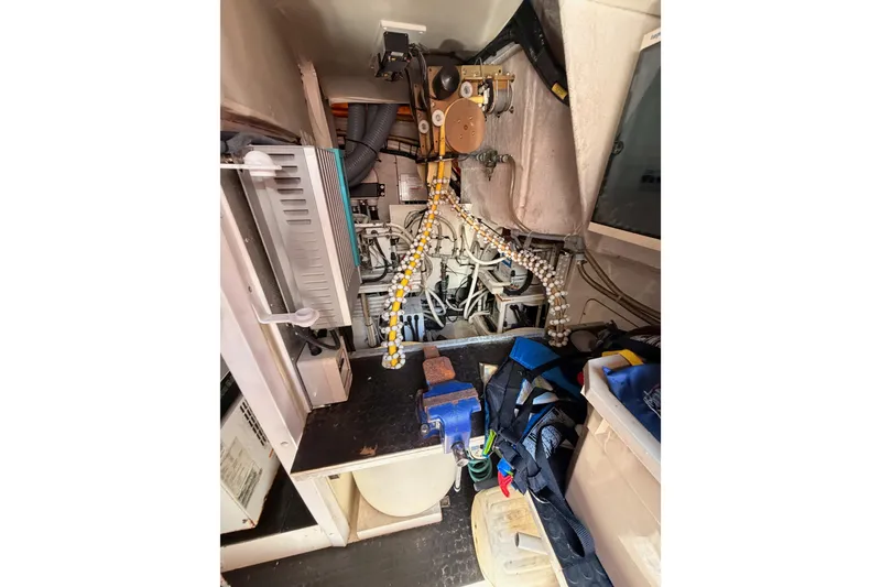 Slide: The Image of Engine room of 2007 Viking Princess 54 Flybridge yacht, showcasing mechanical components and equipment. - 92