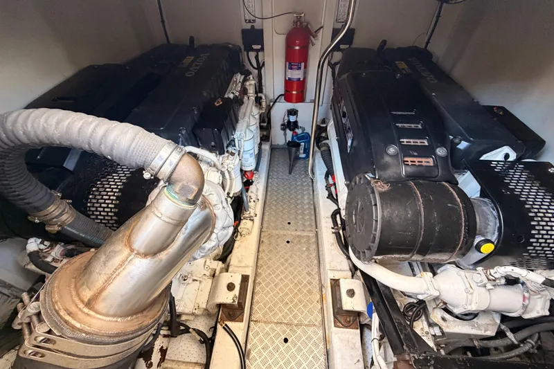 Slide: The Image of Engine room of 2007 Viking Princess 54 Flybridge yacht, featuring dual Volvo engines. - 94