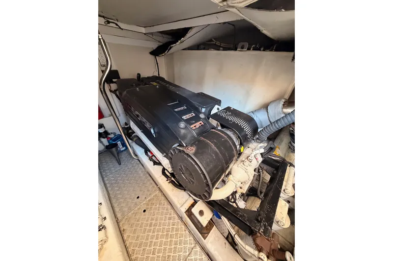 Slide: The Image of Engine room of 2007 Viking Princess 54 Flybridge yacht, showcasing machinery and components. - 96