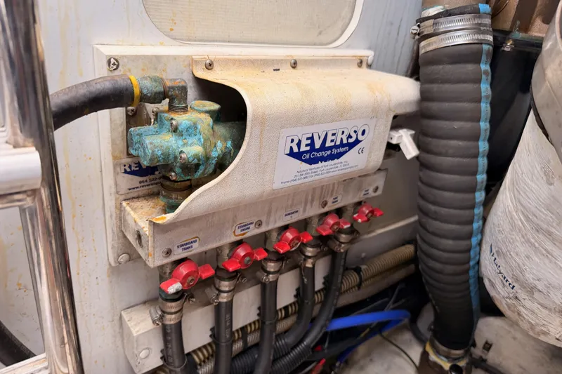 Slide: The Image of Reverso oil change system in 2007 Viking Princess 54 Flybridge yacht engine room. - 99