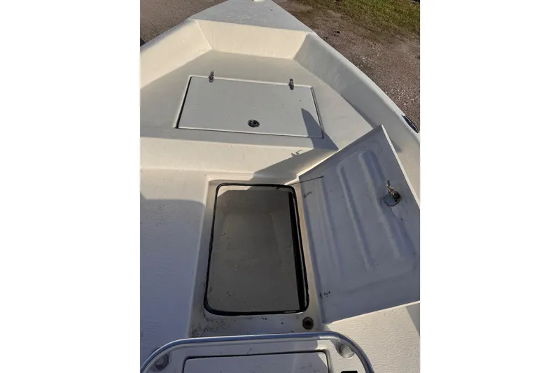 Slide: The Image of Open storage compartment on a 2006 South Shore 26 boat deck. - 20