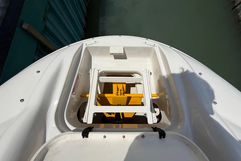 Slide: The Image of Bow storage compartment on a 2004 Sea Ray 240 Sundeck boat. - 27