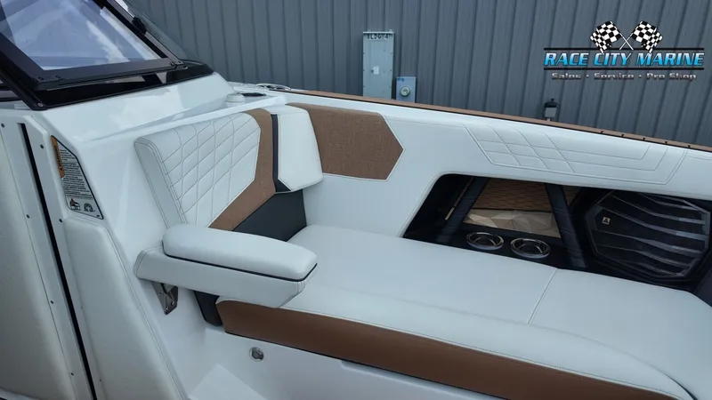 Slide: The Image of The image shows the luxurious interior of a 2022 Nautique G25 boat with elegant seating. - 19