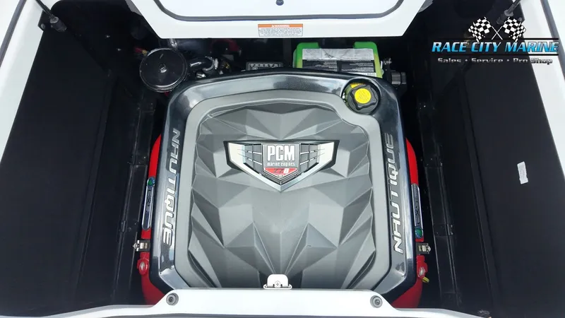 Slide: The Image of The engine compartment of a 2022 Nautique G25 boat features a powerful PCM engine. - 22