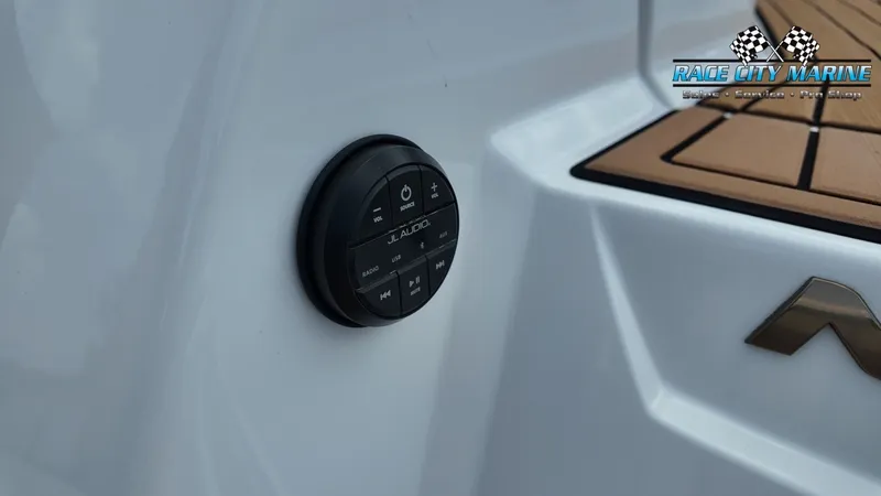 Slide: The Image of Close-up of a JL Audio volume control on a 2022 Nautique G25 boat. - 14