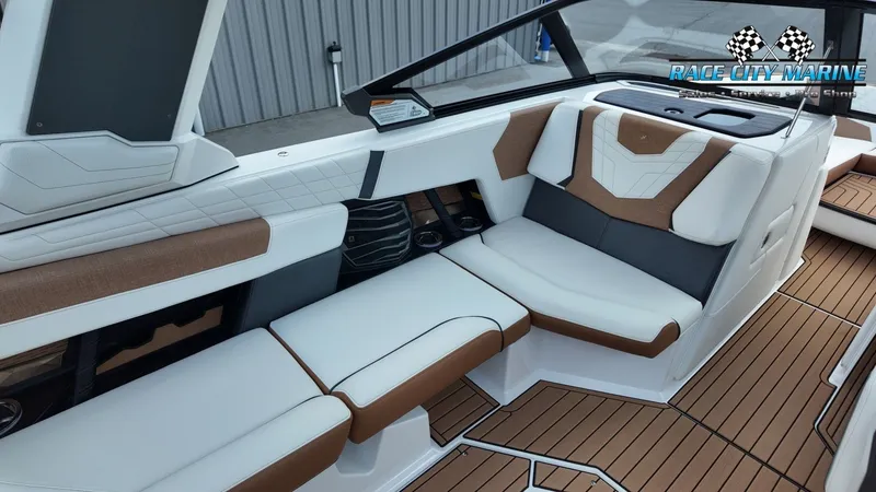 Slide: The Image of The image shows the luxurious interior of a 2022 Nautique G25 boat with elegant seating. - 31