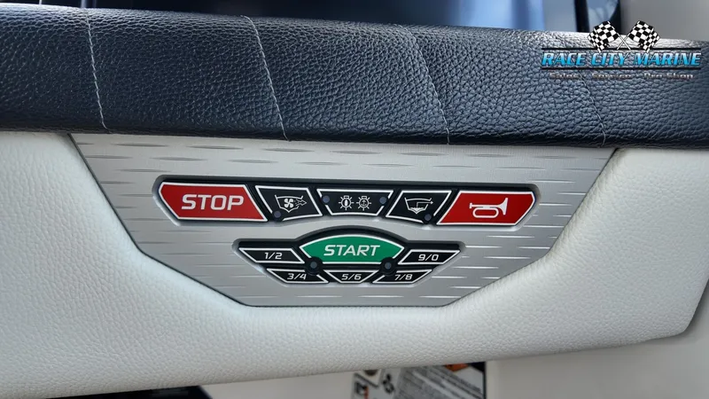 Slide: The Image of Close-up of a boat panel with start and stop buttons and various indicator lights. - 47