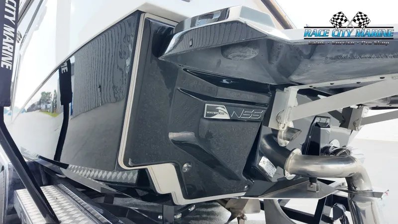 Slide: The Image of Close-up of a 2022 Nautique G25's stern with NFS logo and exhaust. - 10