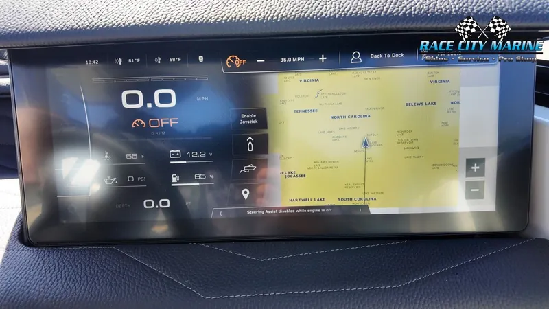 Slide: The Image of The image shows the dashboard of a 2022 Nautique G25 with a digital display. - 32