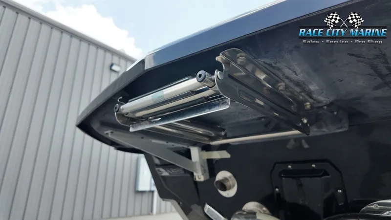 Slide: The Image of Close-up of the stern of a 2022 Nautique G25 with trim tabs. - 9