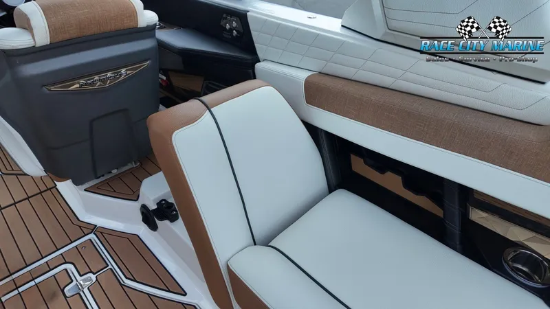Slide: The Image of Interior of a 2022 Nautique G25 featuring sleek seating and modern design. - 50