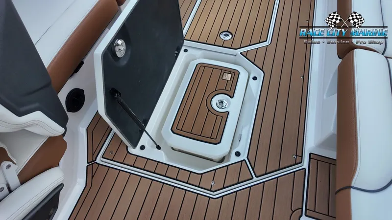 Slide: The Image of The image shows the deck of a 2022 Nautique G25 boat with brown and white accents. - 45