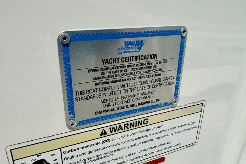 Slide: The Image of 2015 Chaparral Sunesta 264 yacht certification and safety compliance warning label. - 102