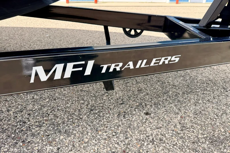Slide: The Image of MFI Trailers logo on a black trailer frame, Chaparral Sunesta 264, 2015 model. - 104