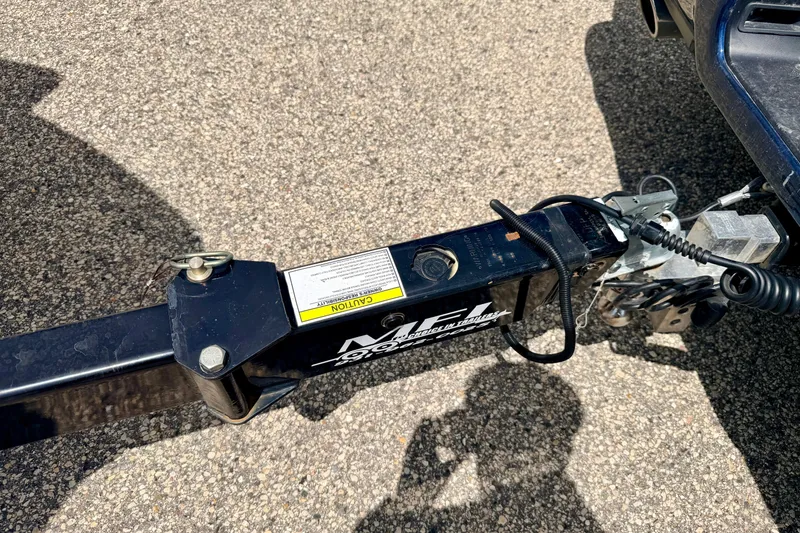 Slide: The Image of Trailer hitch of a 2015 Chaparral Sunesta 264 on asphalt surface. - 107