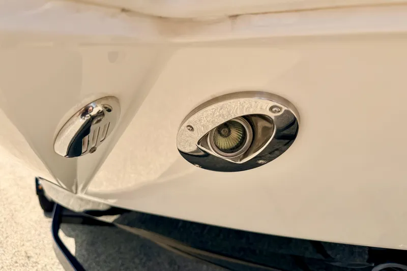 Slide: The Image of 2015 Chaparral Sunesta 264 boat detail showing stainless steel fittings and light fixture. - 109