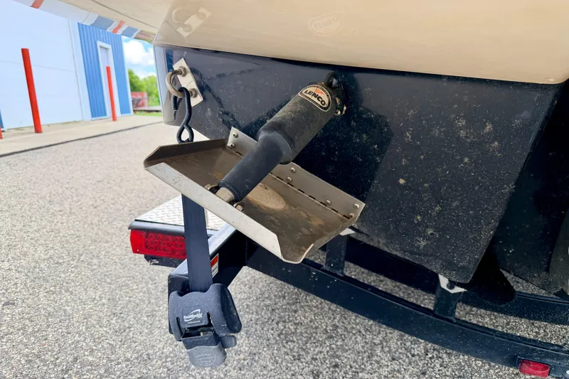 Slide: The Image of 2015 Chaparral Sunesta 264 boat trailer with trim tab and hitch detail. - 18