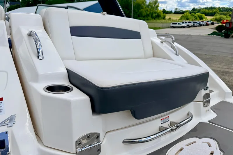 Slide: The Image of 2015 Chaparral Sunesta 264 boat seat with cup holder and sleek design. - 20
