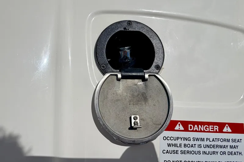Slide: The Image of Fuel cap of 2015 Chaparral Sunesta 264 boat with safety warning label. - 25